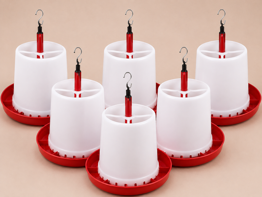 Six white plastic poultry super feeder with red bases and red hanging tubes, arranged on a beige background.